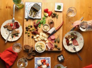 supper table (meats, cheese, bread)