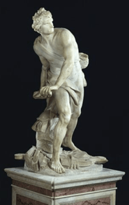 A full-length marble sculpture of David when he is about to throw the stone that will bring down Goliath.