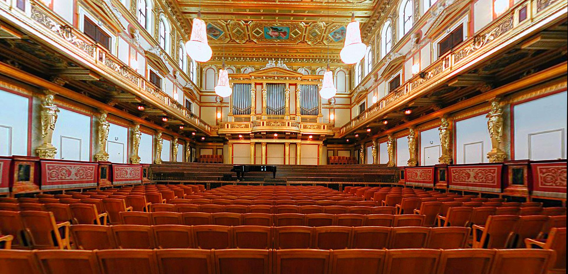 A spacious room filled with numerous chairs and a grand organ, creating an atmosphere of elegance and musical potential.
