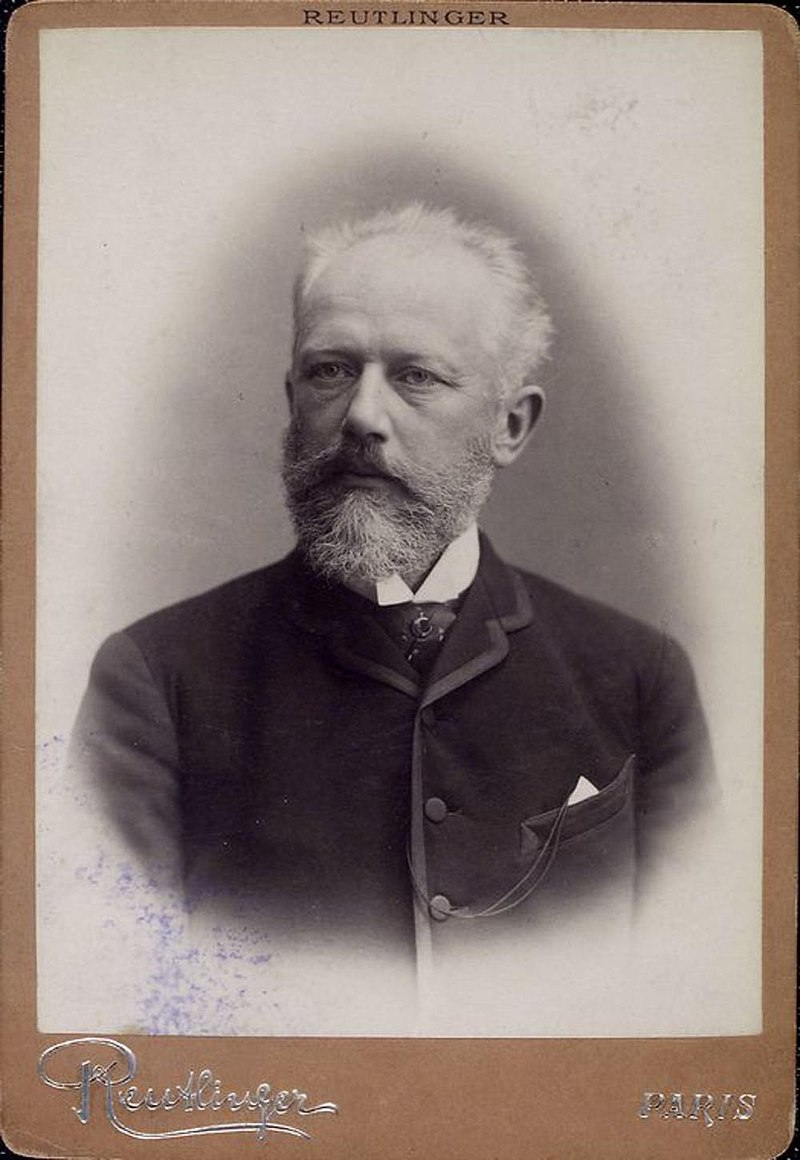 Vintage image of a bearded man in a suit, capturing a moment from the past with a classic and distinguished appearance.