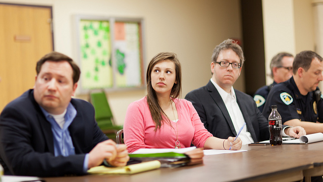 A woman taking notes during a lecture