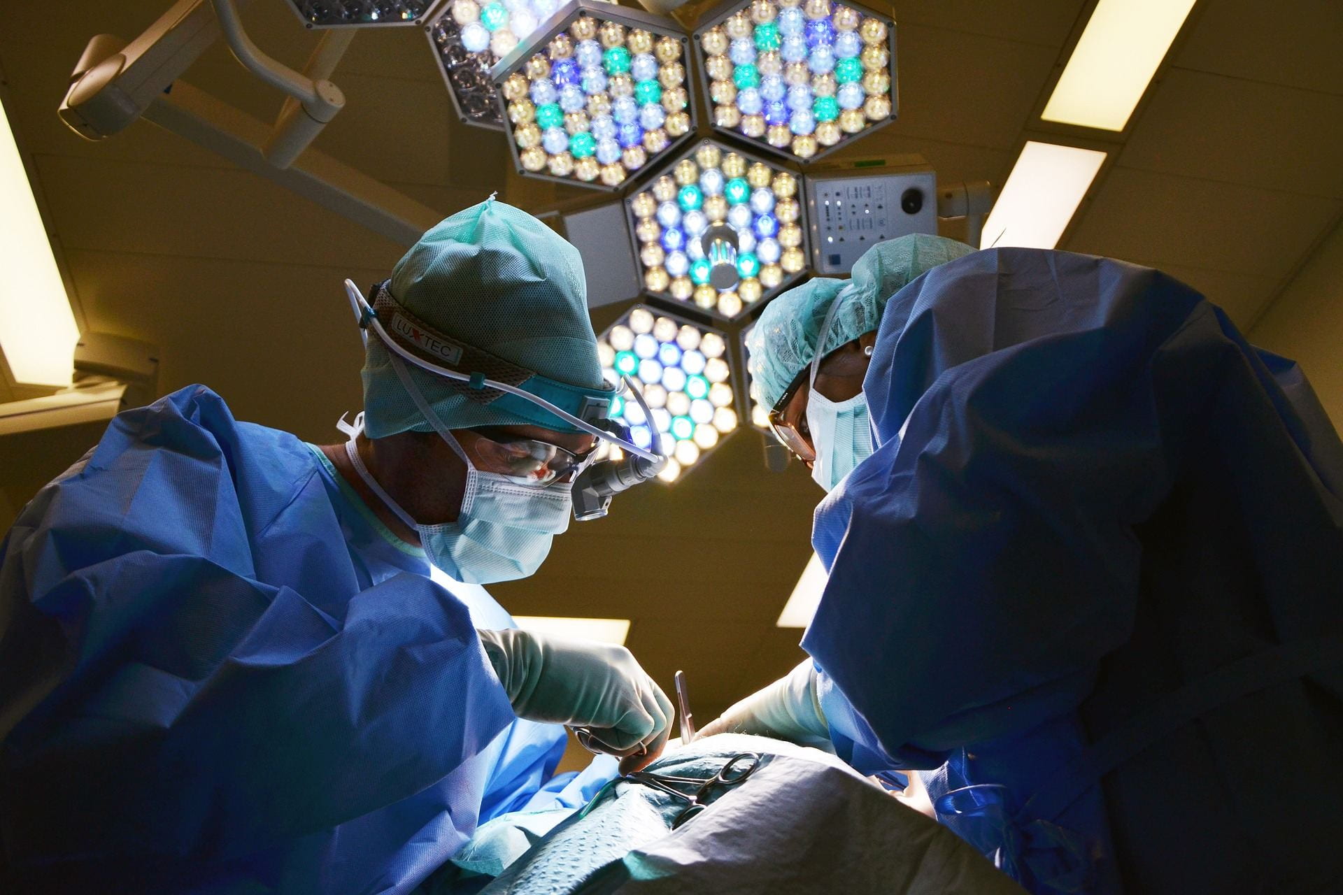 Two surgeons operate on a patient